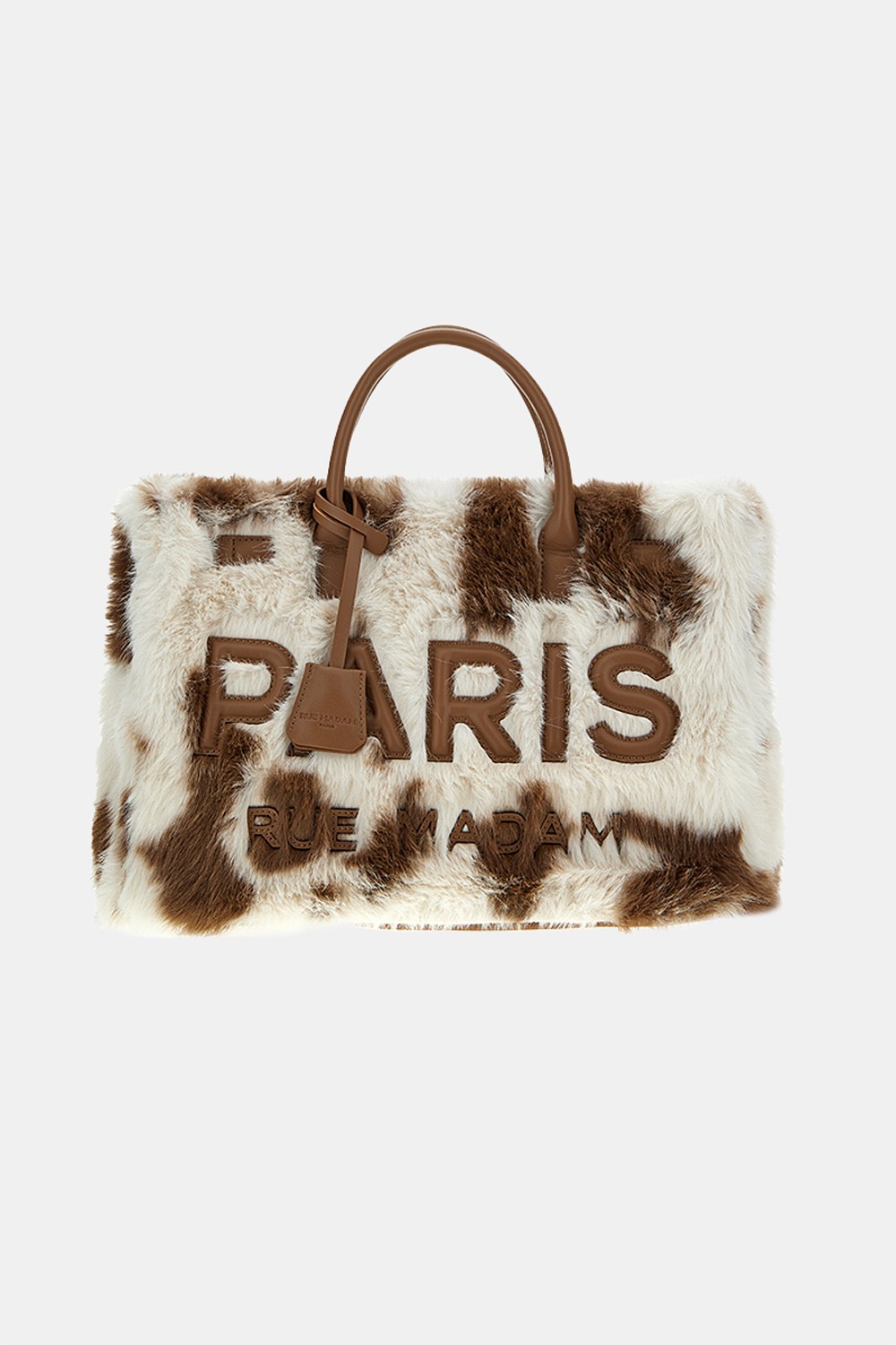 Bolso Dakota Tote Fur Cow Print de Rue Madam Paris, diseño único con estampado de vaca y detalles en peluche, ideal para un estilo audaz y elegante.